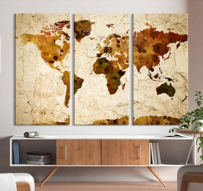 The Sepia World Map Wall Art Canvas Print showcases a vintage world map on a textured background, expertly mounted on museum-quality canvas with a UV-protective coating.