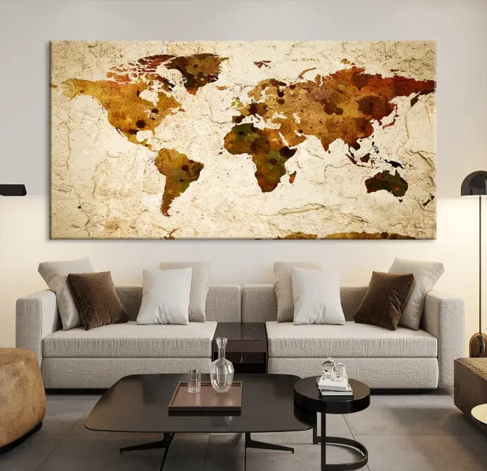 The Sepia World Map Wall Art Canvas Print showcases a vintage world map on a textured background, expertly mounted on museum-quality canvas with a UV-protective coating.