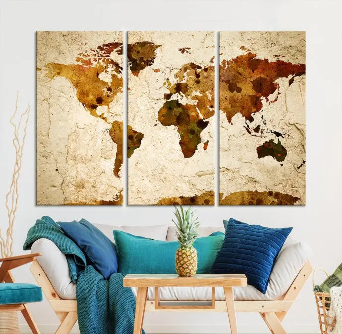 The Sepia World Map Wall Art Canvas Print showcases a vintage world map on a textured background, expertly mounted on museum-quality canvas with a UV-protective coating.