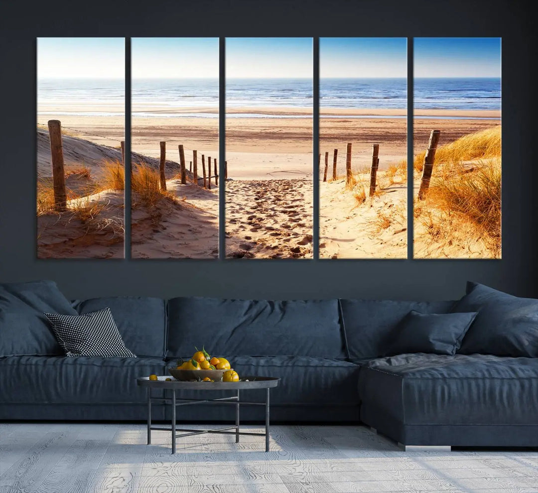 A triptych of Serene Beach Path Canvas Art, a giclee canvas print with gallery wrap, adorns the wall. This stunning coastal sand dunes wall art, crafted with Canon print quality, adds a tranquil touch to the space.