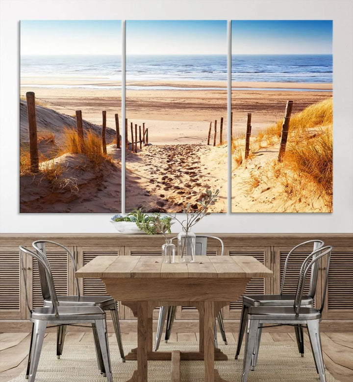 A triptych of Serene Beach Path Canvas Art, a giclee canvas print with gallery wrap, adorns the wall. This stunning coastal sand dunes wall art, crafted with Canon print quality, adds a tranquil touch to the space.