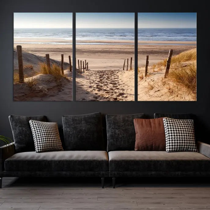 The "Serene Beach Path Canvas – Coastal Landscape Wall Art Triptych – Tranquil Ocean View for Living Room" is tastefully displayed, adding a beautiful coastal touch to the room's ambiance.