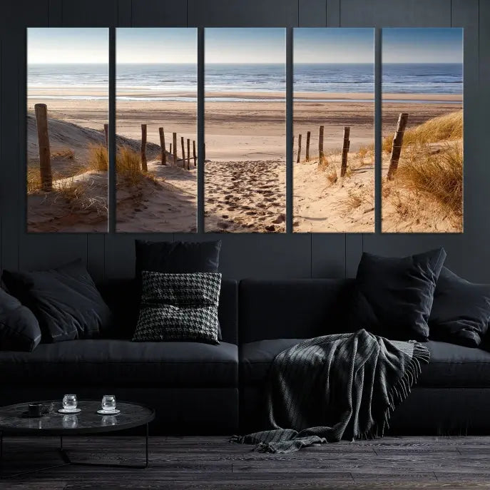 The "Serene Beach Path Canvas – Coastal Landscape Wall Art Triptych – Tranquil Ocean View for Living Room" is tastefully displayed, adding a beautiful coastal touch to the room's ambiance.