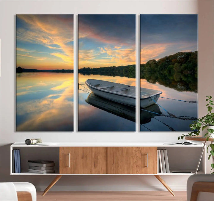 Serene rowboat on calm lake triptych canvas art with sunset reflections. Giclee print for tranquil home or office decor.