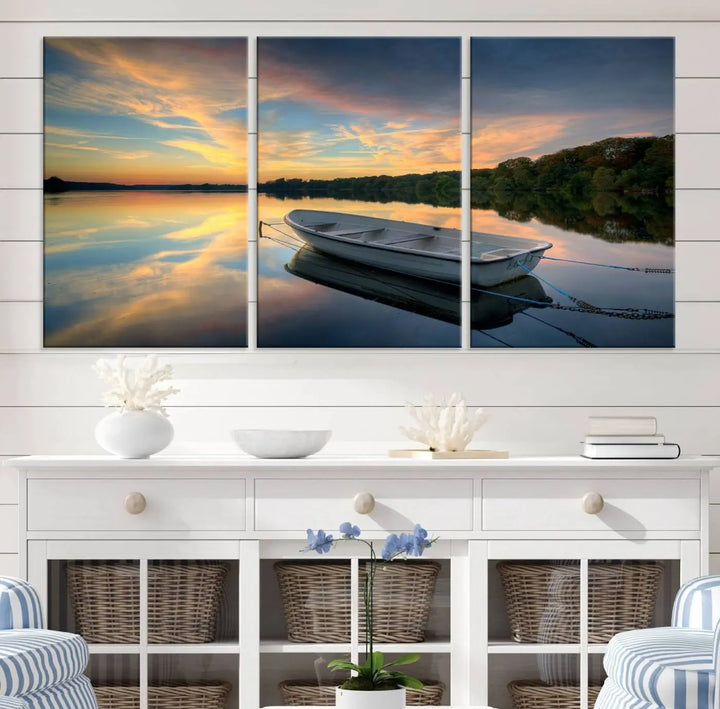 Serene rowboat on calm lake triptych canvas art with sunset reflections. Giclee print for tranquil home or office decor.