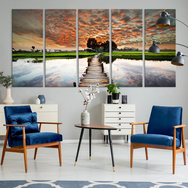 Serene sunset wooden bridge triptych canvas art. Giclee print with vibrant sunset reflections, perfect for tranquil and scenic spaces.