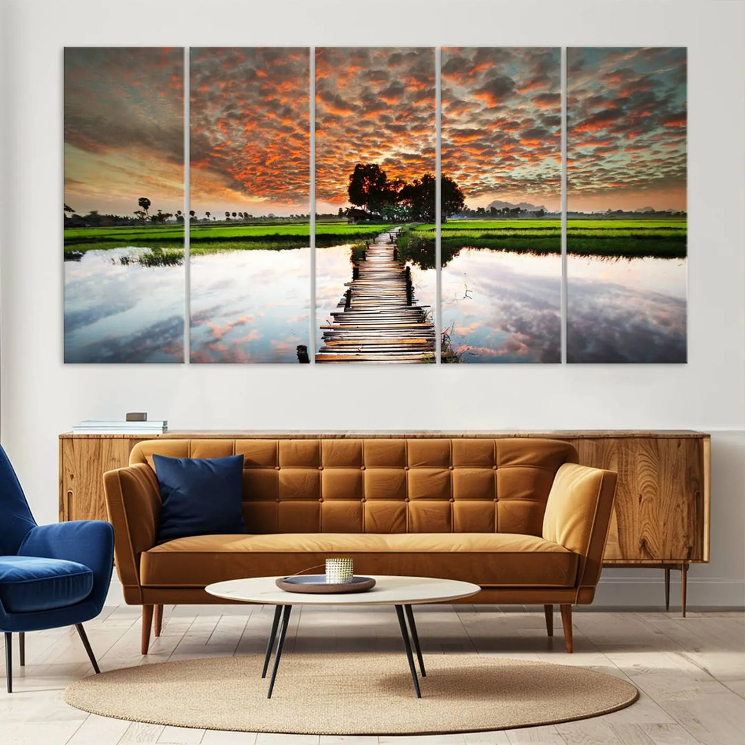 Serene sunset wooden bridge triptych canvas art. Giclee print with vibrant sunset reflections, perfect for tranquil and scenic spaces.