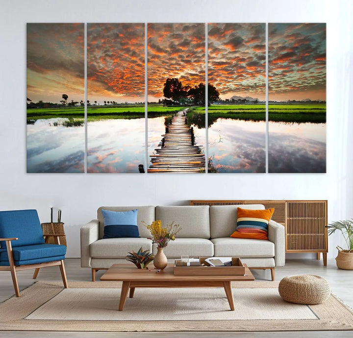 Serene sunset wooden bridge triptych canvas art. Giclee print with vibrant sunset reflections, perfect for tranquil and scenic spaces.