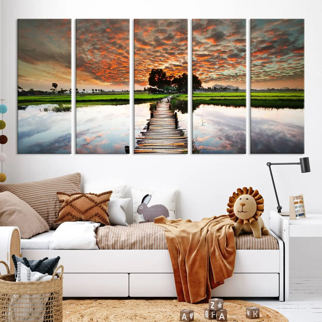 Serene sunset wooden bridge triptych canvas art. Giclee print with vibrant sunset reflections, perfect for tranquil and scenic spaces.