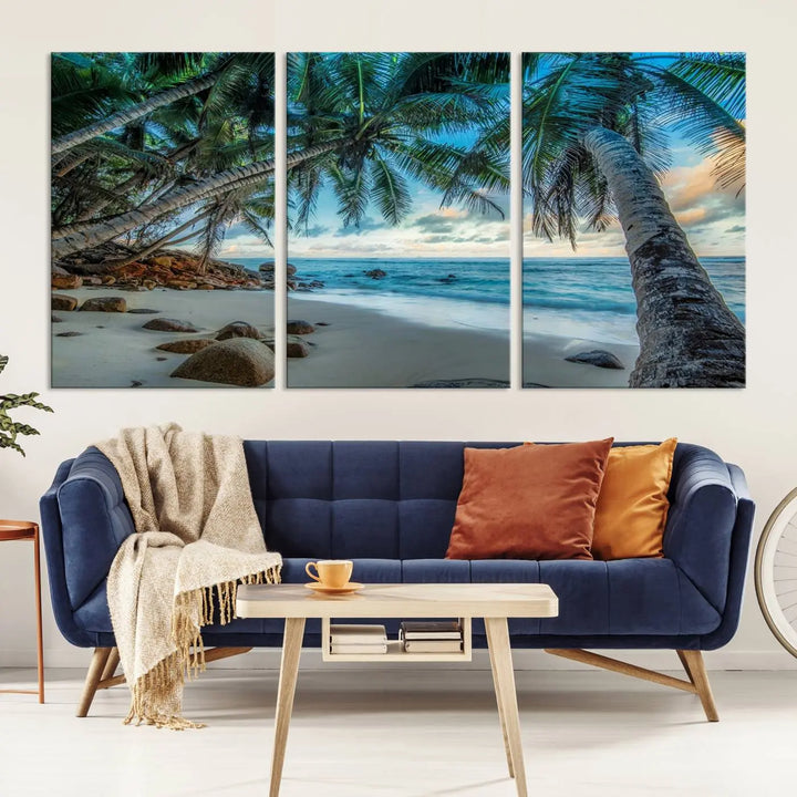 The Serene Tropical Beach Palm Trees Wall Art Canvas Print—a Coastal Paradise 3-Panel Artwork featuring ocean waves—enhances the space with its Giclee technology print.