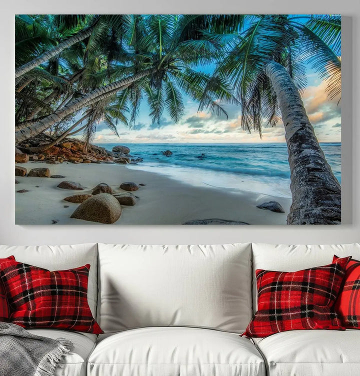 The Serene Tropical Beach Palm Trees Wall Art Canvas Print—a Coastal Paradise 3-Panel Artwork featuring ocean waves—enhances the space with its Giclee technology print.