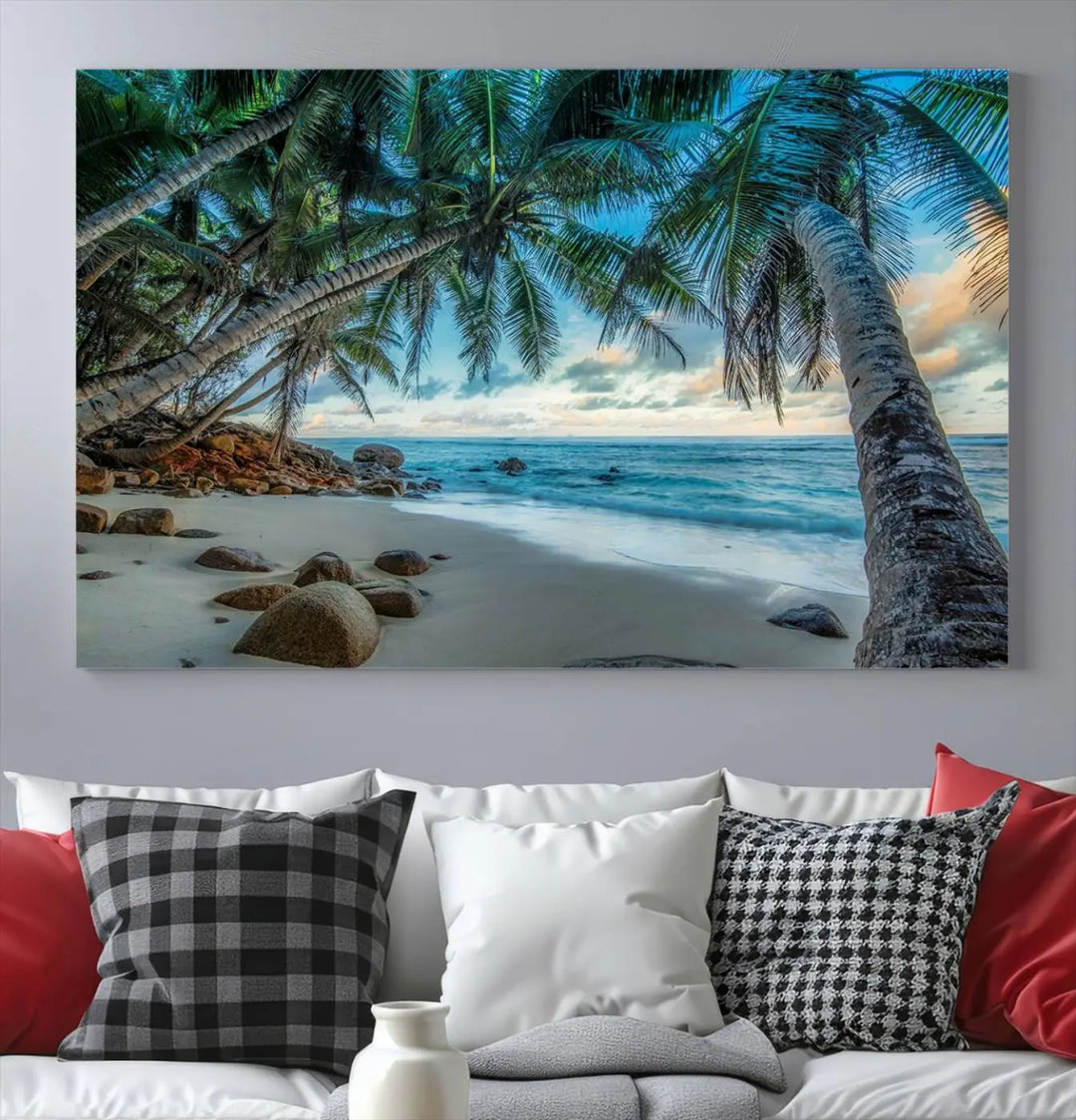 The Serene Tropical Beach Palm Trees Wall Art Canvas Print—a Coastal Paradise 3-Panel Artwork featuring ocean waves—enhances the space with its Giclee technology print.