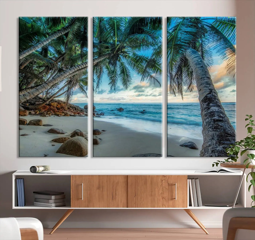 The Serene Tropical Beach Palm Trees Wall Art Canvas Print—a Coastal Paradise 3-Panel Artwork featuring ocean waves—enhances the space with its Giclee technology print.