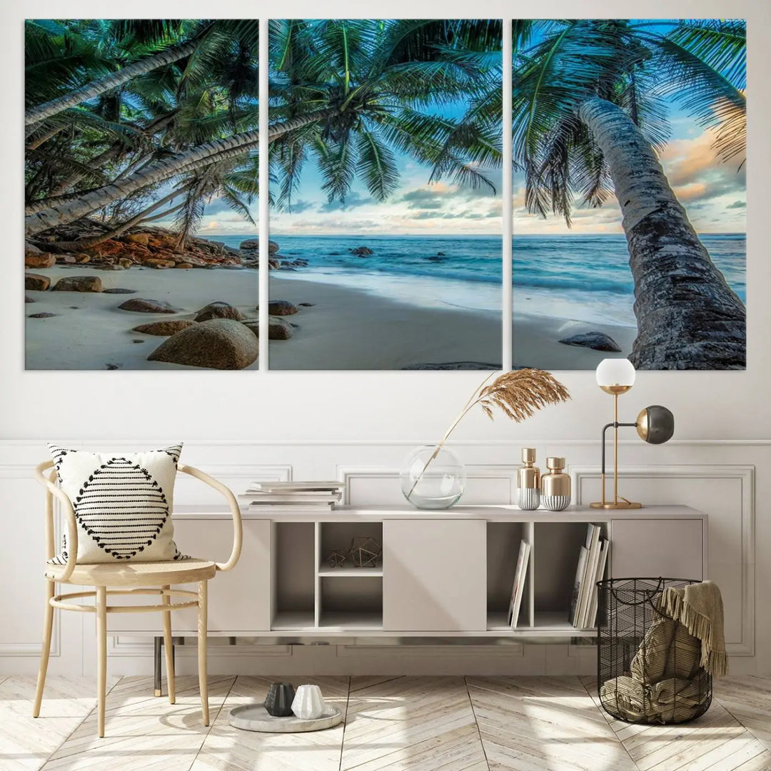 The Serene Tropical Beach Palm Trees Wall Art Canvas Print—a Coastal Paradise 3-Panel Artwork featuring ocean waves—enhances the space with its Giclee technology print.