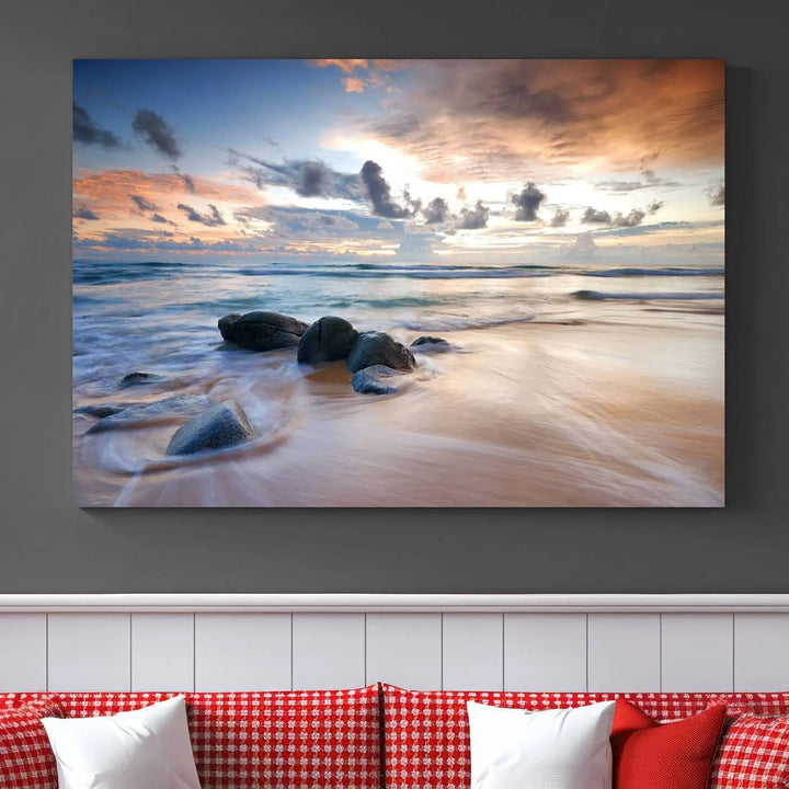 The "Serene Weather On The Beach Wall Art Canvas Print," featuring a tranquil beach scene with rocks and waves, is ready to hang and enjoy.