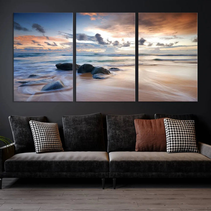 The "Serene Weather On The Beach Wall Art Canvas Print," featuring a tranquil beach scene with rocks and waves, is ready to hang and enjoy.