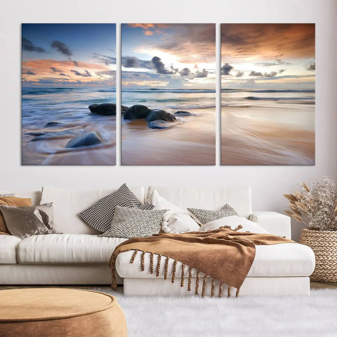 The "Serene Weather On The Beach Wall Art Canvas Print," featuring a tranquil beach scene with rocks and waves, is ready to hang and enjoy.