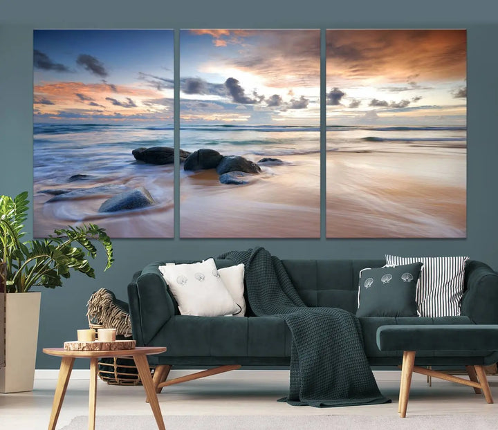 The "Serene Weather On The Beach Wall Art Canvas Print," featuring a tranquil beach scene with rocks and waves, is ready to hang and enjoy.