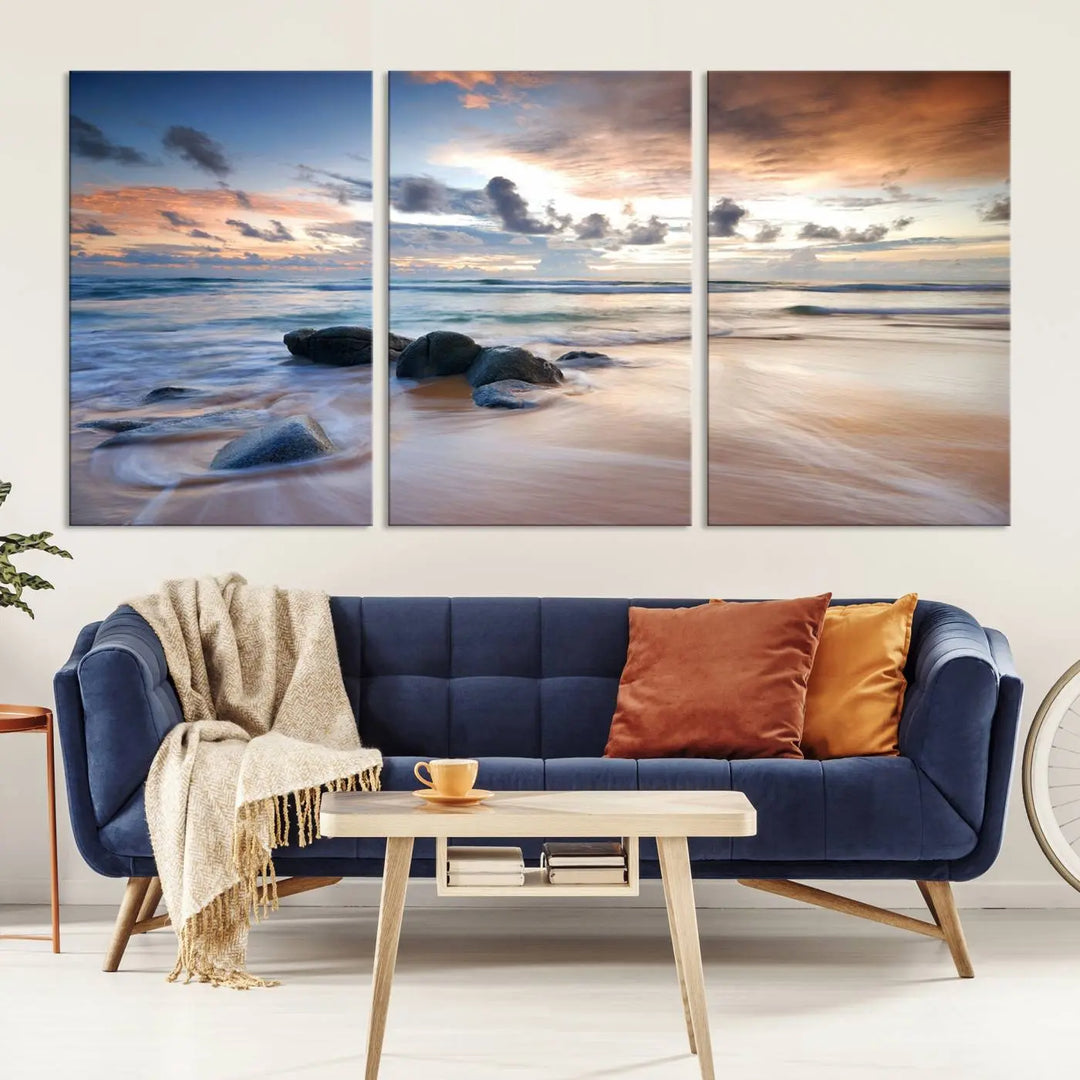 The "Serene Weather On The Beach Wall Art Canvas Print," featuring a tranquil beach scene with rocks and waves, is ready to hang and enjoy.