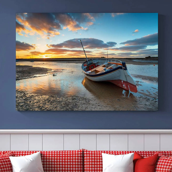 The "Small Boat At The Beach Sunset Wall Art Canvas Print," a three-panel masterpiece crafted on museum-quality canvas, hangs elegantly.