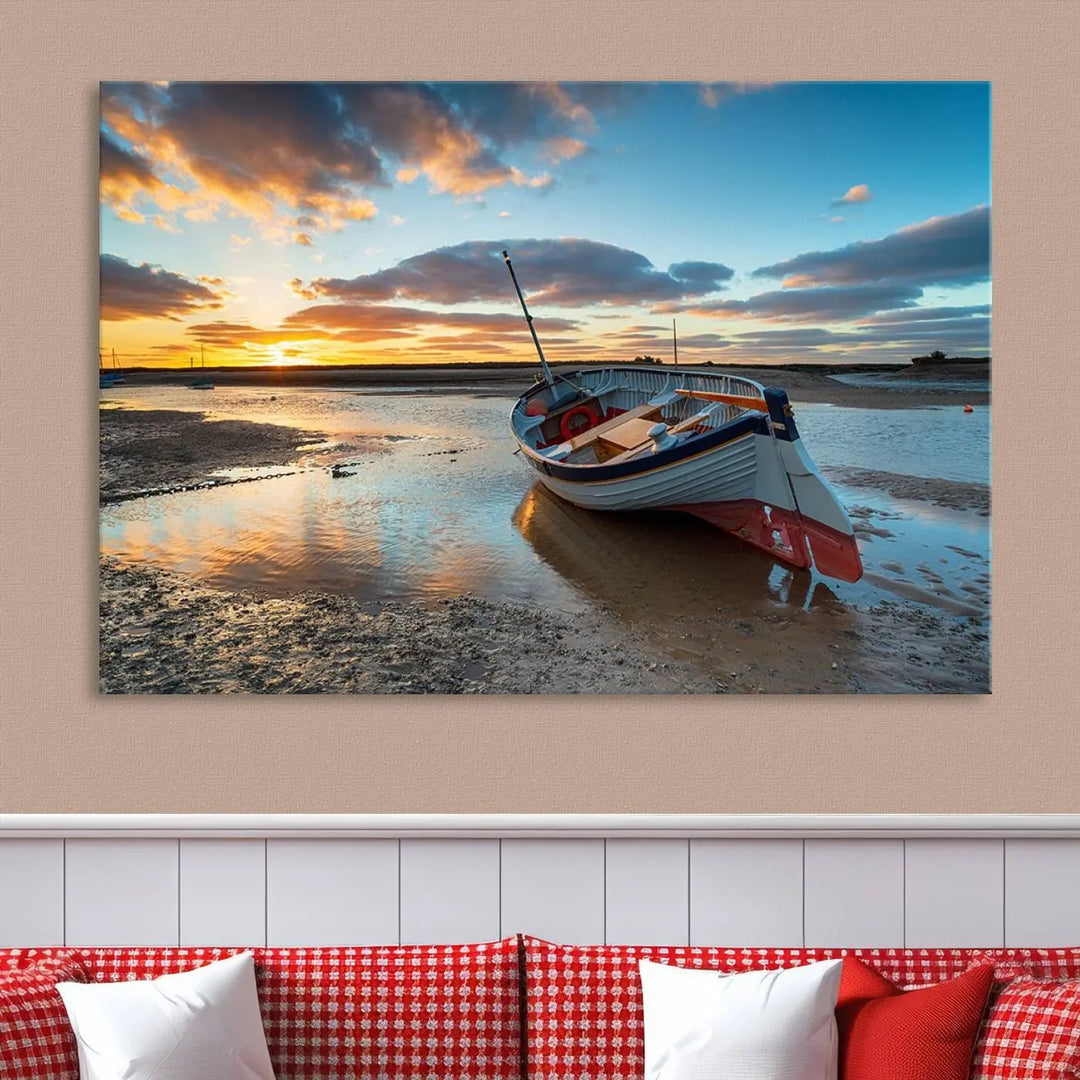 The "Small Boat At The Beach Sunset Wall Art Canvas Print," a three-panel masterpiece crafted on museum-quality canvas, hangs elegantly.