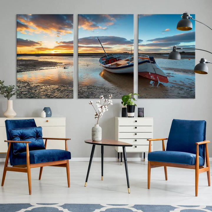 The "Small Boat At The Beach Sunset Wall Art Canvas Print," a three-panel masterpiece crafted on museum-quality canvas, hangs elegantly.