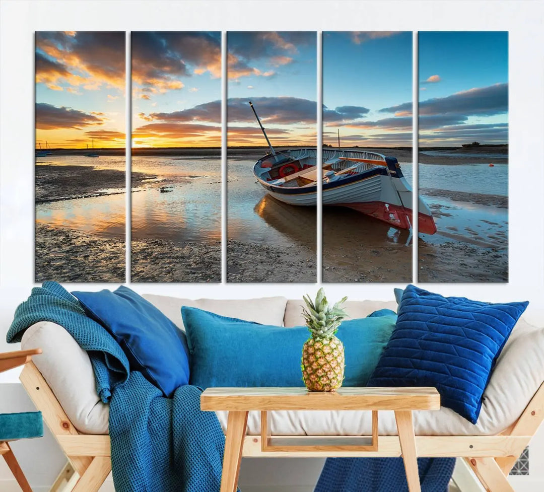 The "Small Boat At The Beach Sunset Wall Art Canvas Print," a three-panel masterpiece crafted on museum-quality canvas, hangs elegantly.