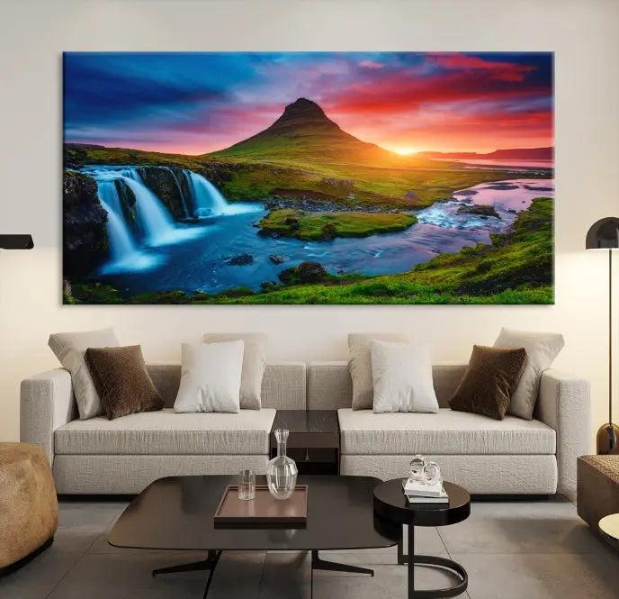 The living room displays a triptych wall art titled "Snaefellsjökull Nal Park and Kirkjufell Mountain," which captures a stunning sunset over a mountain and waterfall on museum-quality canvas. Each piece of the artwork is treated with UV-protective coating to ensure long-lasting vibrancy.