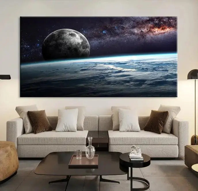 The Space and Planet Canvas Print, a triptych showcasing Earth and the Moon from space on museum-quality canvas with UV-protective coating, hangs prominently in the room.