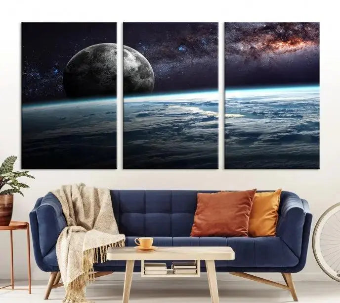 The Space and Planet Canvas Print, a triptych showcasing Earth and the Moon from space on museum-quality canvas with UV-protective coating, hangs prominently in the room.