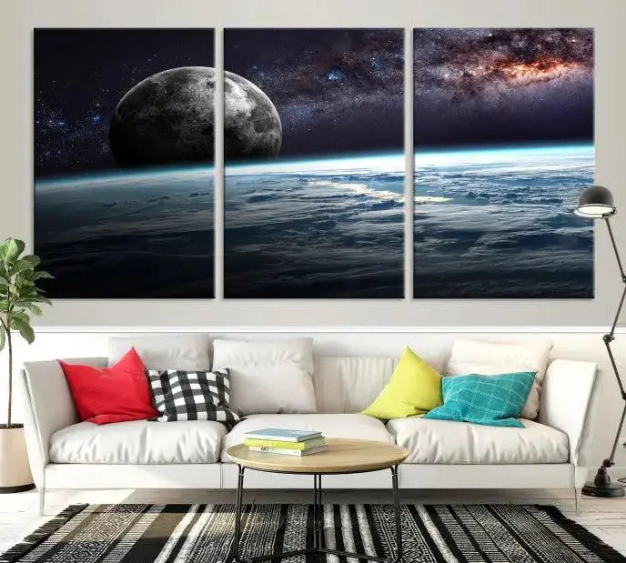 The Space and Planet Canvas Print, a triptych showcasing Earth and the Moon from space on museum-quality canvas with UV-protective coating, hangs prominently in the room.