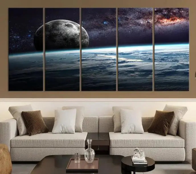 The Space and Planet Canvas Print, a triptych showcasing Earth and the Moon from space on museum-quality canvas with UV-protective coating, hangs prominently in the room.