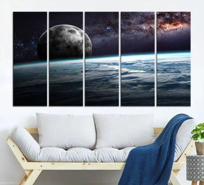 The Space and Planet Canvas Print, a triptych showcasing Earth and the Moon from space on museum-quality canvas with UV-protective coating, hangs prominently in the room.