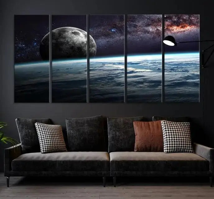 The Space and Planet Canvas Print, a triptych showcasing Earth and the Moon from space on museum-quality canvas with UV-protective coating, hangs prominently in the room.