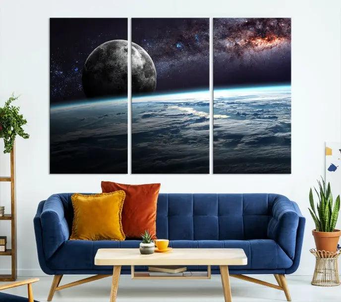 The Space and Planet Canvas Print, a triptych showcasing Earth and the Moon from space on museum-quality canvas with UV-protective coating, hangs prominently in the room.