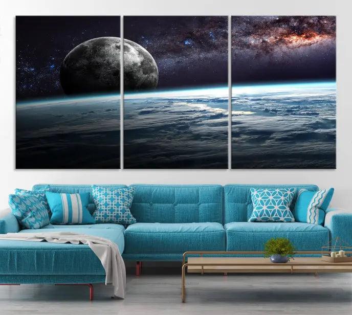 The Space and Planet Canvas Print, a triptych showcasing Earth and the Moon from space on museum-quality canvas with UV-protective coating, hangs prominently in the room.