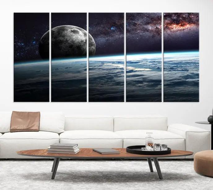 The Space and Planet Canvas Print, a triptych showcasing Earth and the Moon from space on museum-quality canvas with UV-protective coating, hangs prominently in the room.