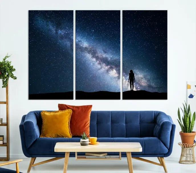 A hand-assembled framed triptych of the "Space and Women Wall Art Canvas Print" showcases a silhouette of a starry night sky on museum-quality canvas.