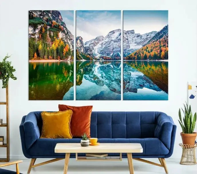 The "Spectacular Autumn View of Braies Lake Wall Art Canvas Print" showcases a serene mountain lake framed by colorful autumn trees reflected in the water. This museum-quality artwork is adorned with a UV-protective coating to maintain its vivid colors and elegantly gallery wrapped to enhance its contemporary appeal.