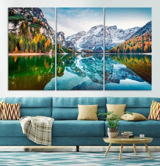 The "Spectacular Autumn View of Braies Lake Wall Art Canvas Print" showcases a serene mountain lake framed by colorful autumn trees reflected in the water. This museum-quality artwork is adorned with a UV-protective coating to maintain its vivid colors and elegantly gallery wrapped to enhance its contemporary appeal.