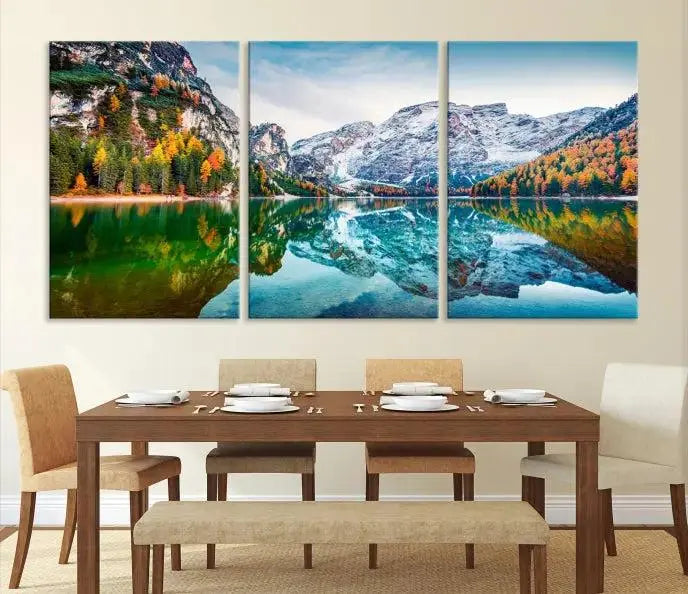 The "Spectacular Autumn View of Braies Lake Wall Art Canvas Print" showcases a serene mountain lake framed by colorful autumn trees reflected in the water. This museum-quality artwork is adorned with a UV-protective coating to maintain its vivid colors and elegantly gallery wrapped to enhance its contemporary appeal.