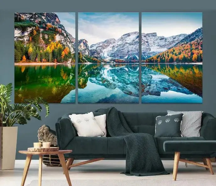 The "Spectacular Autumn View of Braies Lake Wall Art Canvas Print" showcases a serene mountain lake framed by colorful autumn trees reflected in the water. This museum-quality artwork is adorned with a UV-protective coating to maintain its vivid colors and elegantly gallery wrapped to enhance its contemporary appeal.