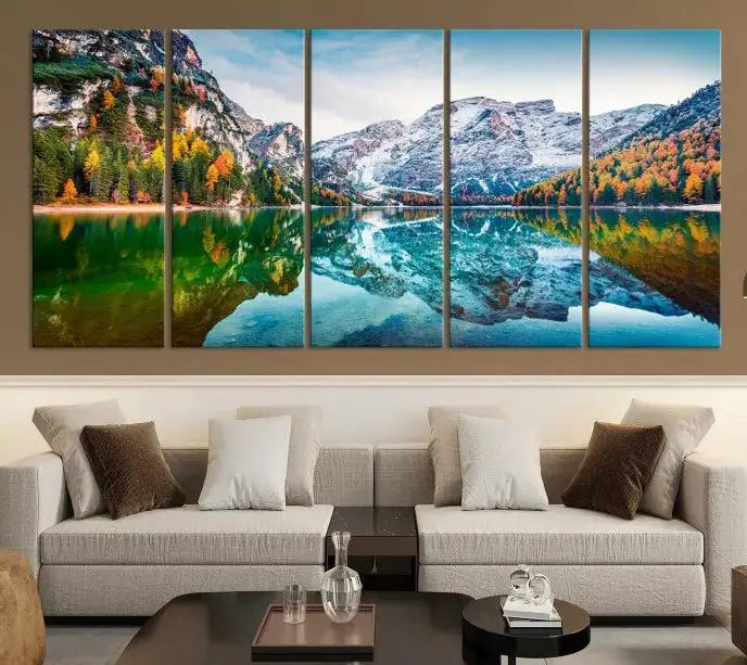 The "Spectacular Autumn View of Braies Lake Wall Art Canvas Print" showcases a serene mountain lake framed by colorful autumn trees reflected in the water. This museum-quality artwork is adorned with a UV-protective coating to maintain its vivid colors and elegantly gallery wrapped to enhance its contemporary appeal.