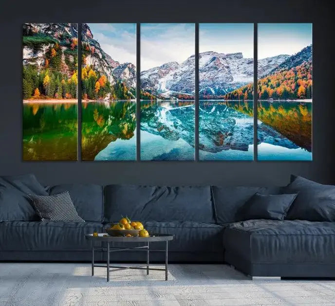 The "Spectacular Autumn View of Braies Lake Wall Art Canvas Print" showcases a serene mountain lake framed by colorful autumn trees reflected in the water. This museum-quality artwork is adorned with a UV-protective coating to maintain its vivid colors and elegantly gallery wrapped to enhance its contemporary appeal.