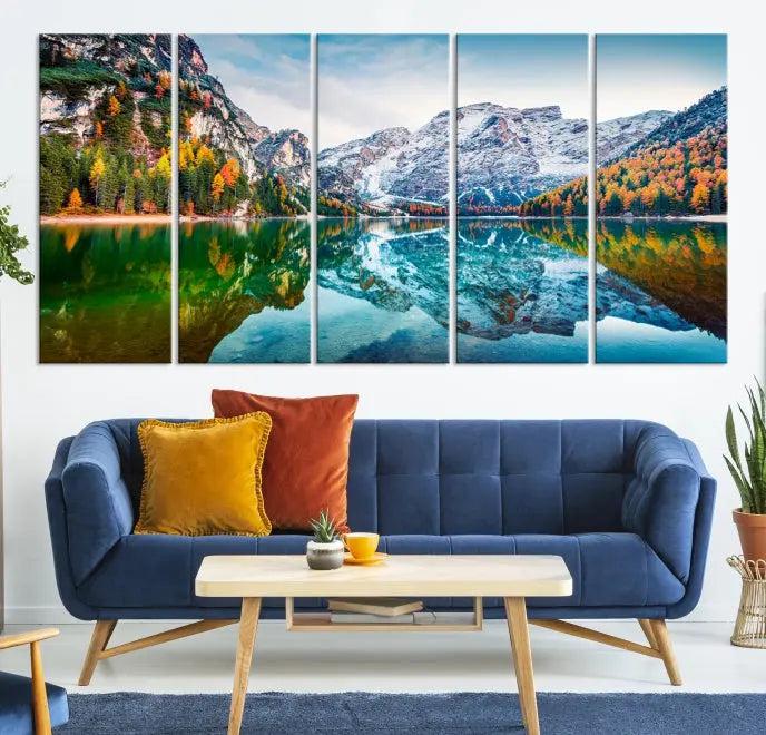 The "Spectacular Autumn View of Braies Lake Wall Art Canvas Print" showcases a serene mountain lake framed by colorful autumn trees reflected in the water. This museum-quality artwork is adorned with a UV-protective coating to maintain its vivid colors and elegantly gallery wrapped to enhance its contemporary appeal.