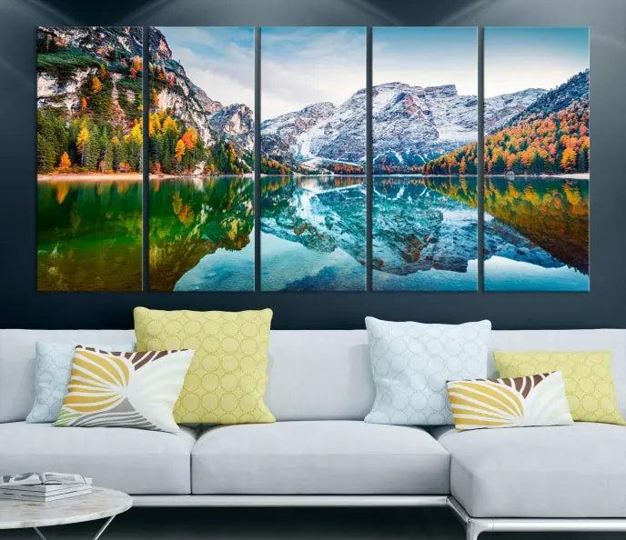 The "Spectacular Autumn View of Braies Lake Wall Art Canvas Print" showcases a serene mountain lake framed by colorful autumn trees reflected in the water. This museum-quality artwork is adorned with a UV-protective coating to maintain its vivid colors and elegantly gallery wrapped to enhance its contemporary appeal.