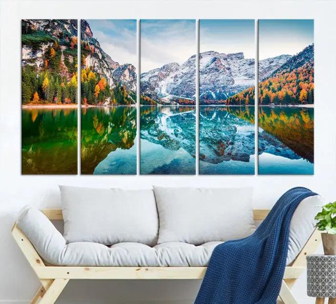 The "Spectacular Autumn View of Braies Lake Wall Art Canvas Print" showcases a serene mountain lake framed by colorful autumn trees reflected in the water. This museum-quality artwork is adorned with a UV-protective coating to maintain its vivid colors and elegantly gallery wrapped to enhance its contemporary appeal.