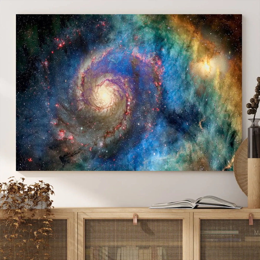 The living room showcases three colorful space-themed paintings titled "Spiral Galaxy Wall Art Canvas Print" on the wall, featuring museum-quality craftsmanship with vibrant colors through high-resolution printing.