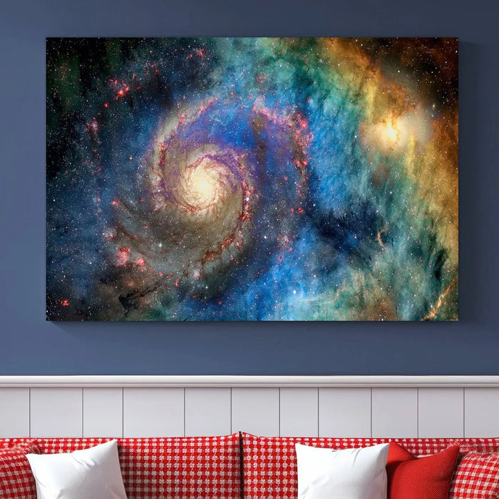 The living room showcases three colorful space-themed paintings titled "Spiral Galaxy Wall Art Canvas Print" on the wall, featuring museum-quality craftsmanship with vibrant colors through high-resolution printing.