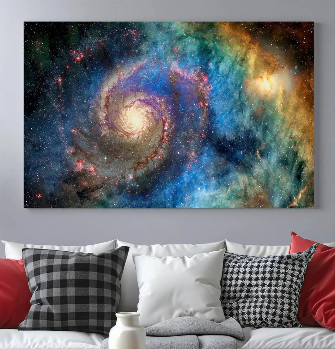 The living room showcases three colorful space-themed paintings titled "Spiral Galaxy Wall Art Canvas Print" on the wall, featuring museum-quality craftsmanship with vibrant colors through high-resolution printing.